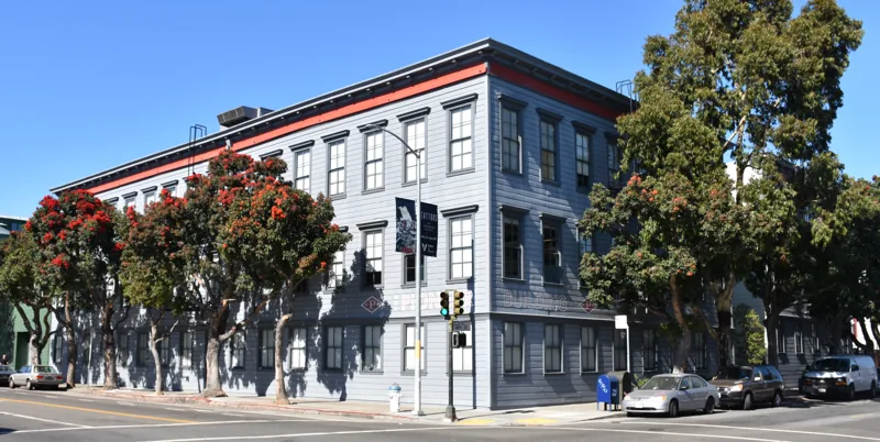 The brick Pioneer Building in San Francisco, with a storefront below.
