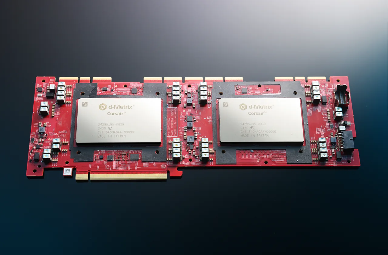 A red d-Matrix Corsair accelerator circuit board with two large metal-covered chip packages.