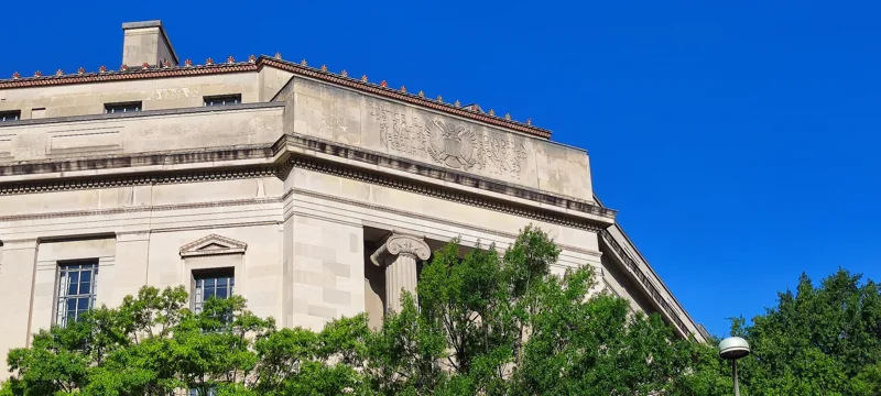 The stone facade and entrance of the Robert F. Kennedy Department of Justice Building.