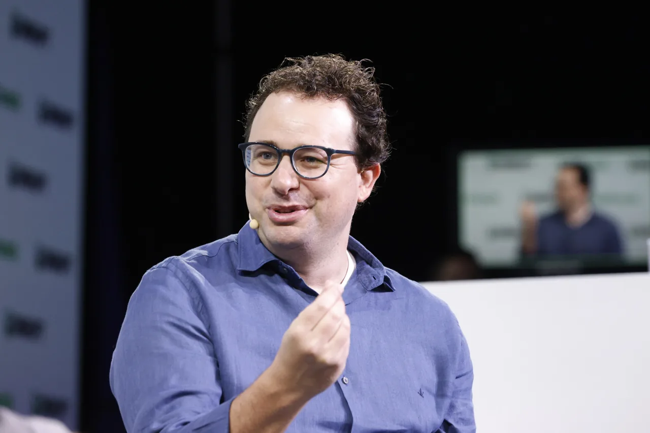 Dario Amodei speaking onstage at TechCrunch Disrupt 2023.